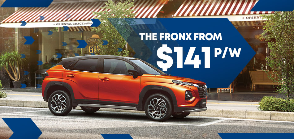 And orange Suzuki SUV with blue graphics behind and infront and white text
